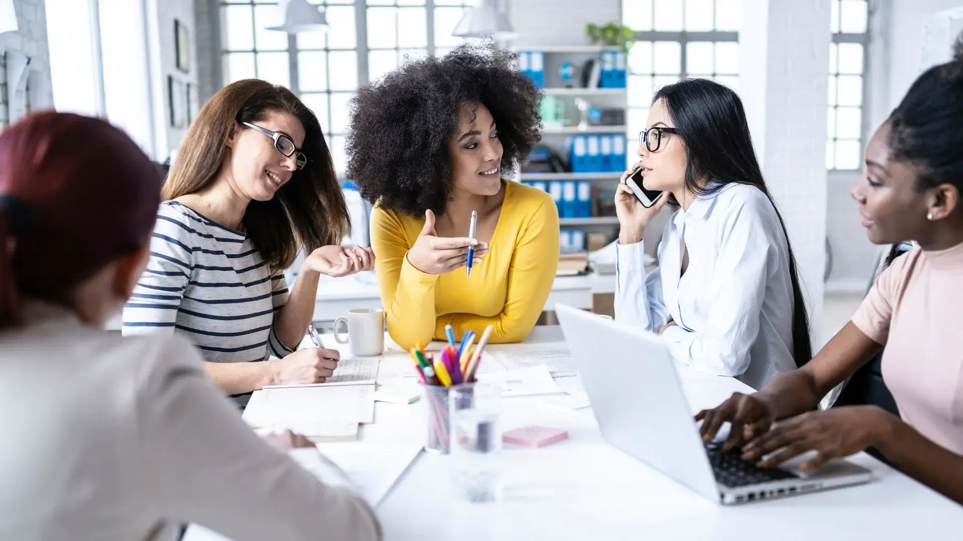 Women sitting at a table in a meeting