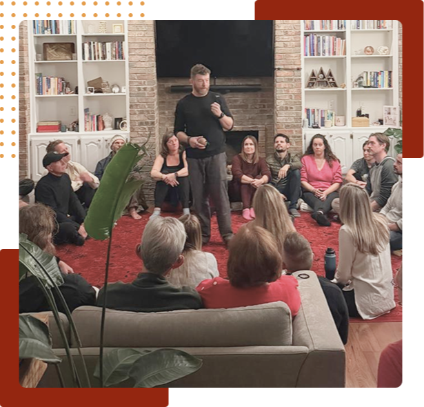 Ricky speaking at the center of a room, facilitating to a live audience during a Conscious Intimacy Games event in Austin Texas.