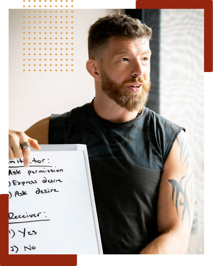 Ricky speaking and gesturing with his hand during an in-person workshop or coaching session in a bright room