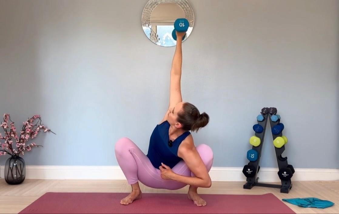 Senior woman at home exercising her upper body for Pilates for Longevity.