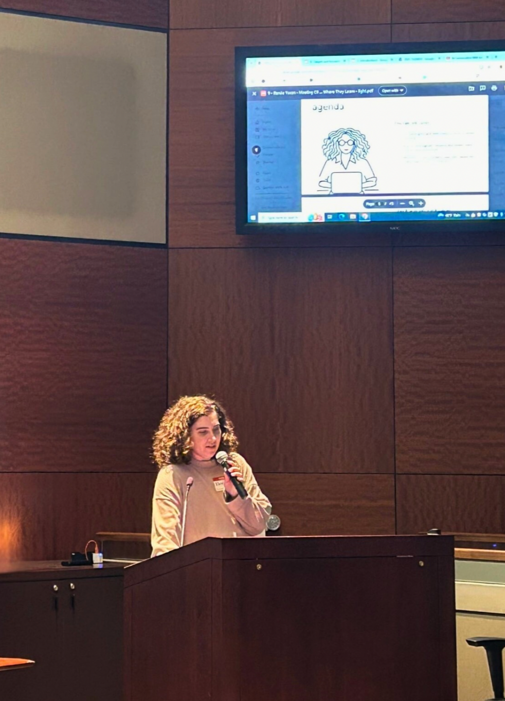 Transgender voice coach Ren&eacute;e Yoxon speaking at academic conference about gender-affirming voice education