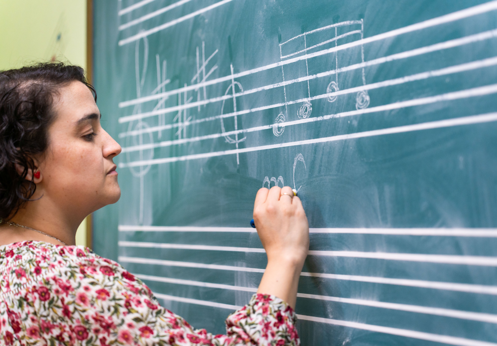 Music teacher managing classroom routines during workshop activity