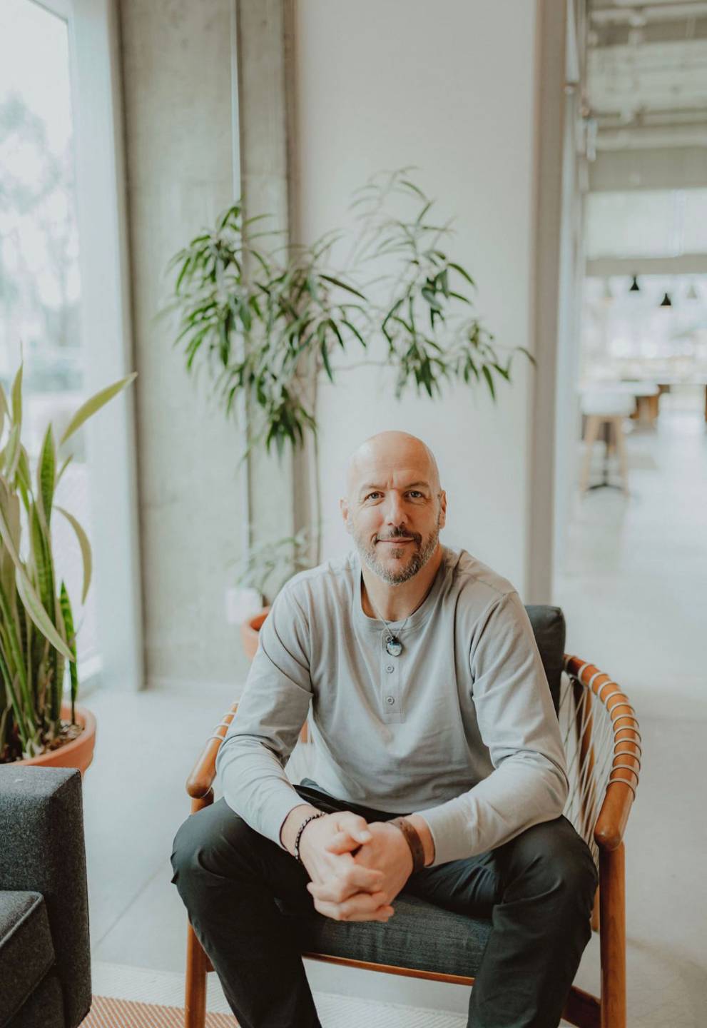 Kevin McNee seated in a wooden chair