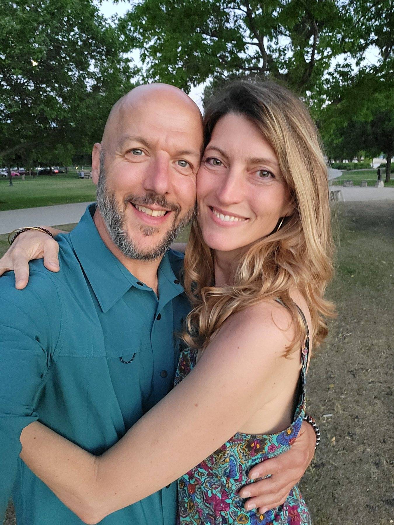 Kevin McNee with his partner Alana, smiling outdoors