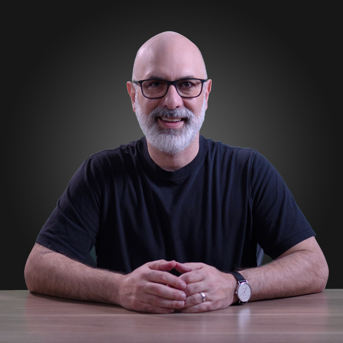 Paul Miklautsch of BOLDR Product Management seated at a table 