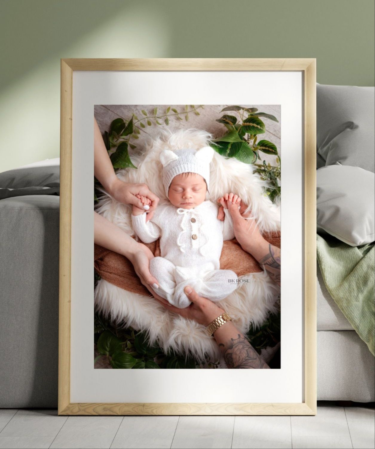 framed photo of a newborn baby with hands holding onto babies hands