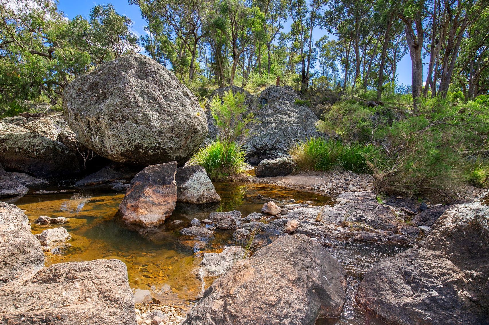 still water and stone in nature symbolising grounding and presence