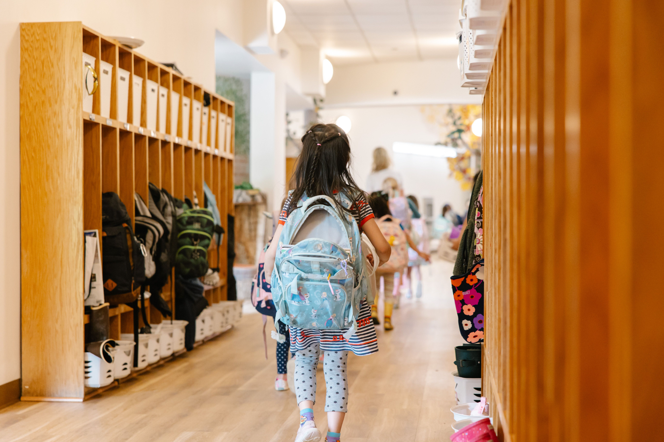 student walking through the halls of a school