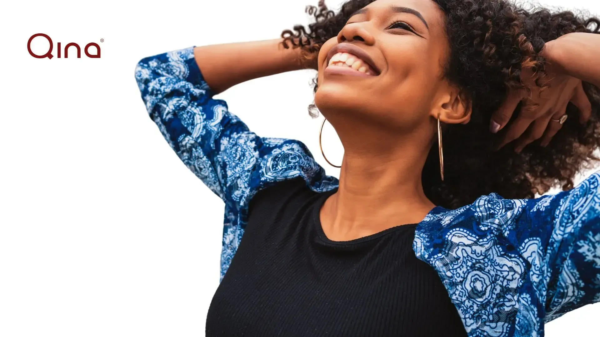 Woman holding hands behind her head