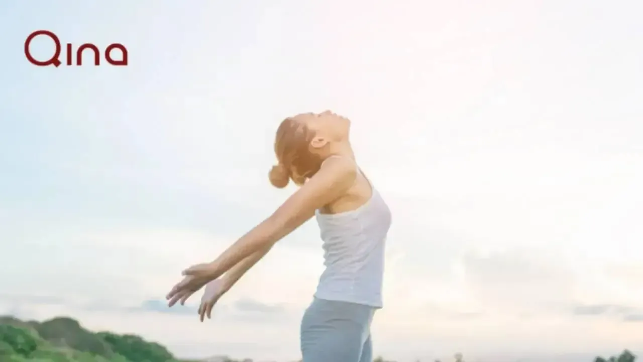 Girl with arms stretched back