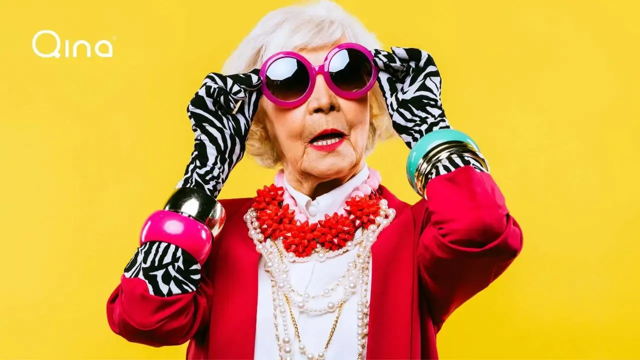 Woman with bright clothes on yellow background