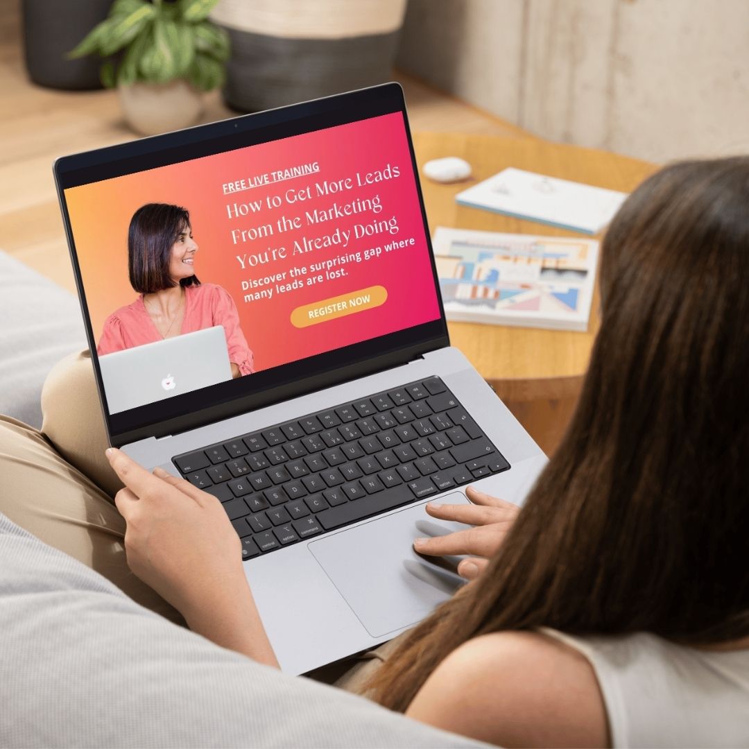 A woman sits in front of a laptop watching the masterclass for the 5 ad mistakes even the pros are making (and how to fix them)