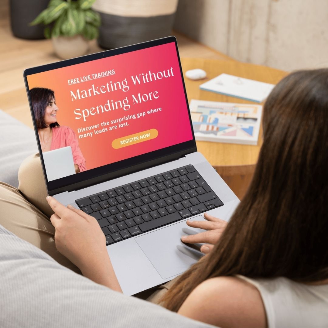 A woman sits in front of a laptop watching the masterclass for the 5 ad mistakes even the pros are making (and how to fix them)