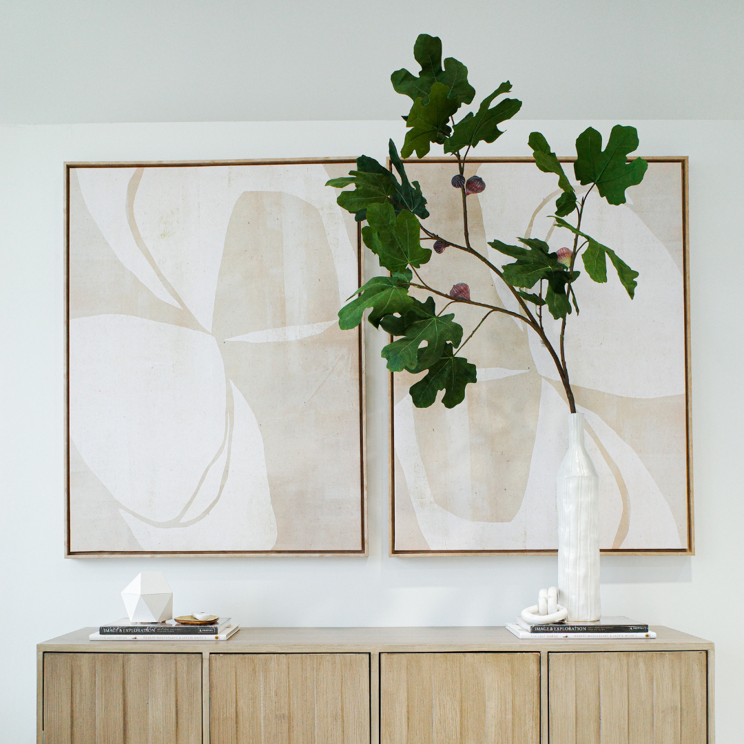Minimalist wooden side table next to a modern chair, representing thoughtful design and simplicity in home decor.