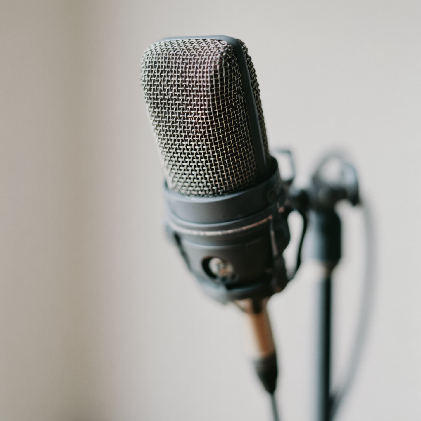 Modern spherical light fixture from Derrick Details, set against a stylish background with curated decor items.