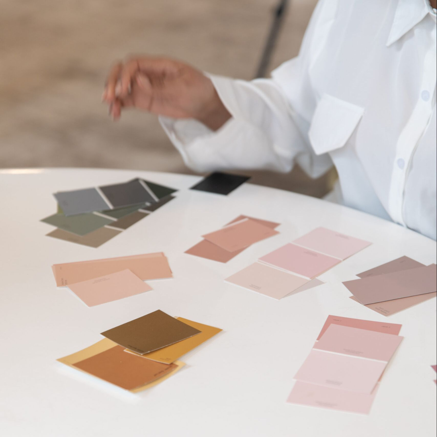 Cozy, modern chair with a wooden side table and decorative vase, representing a blend of comfort and intentional design.