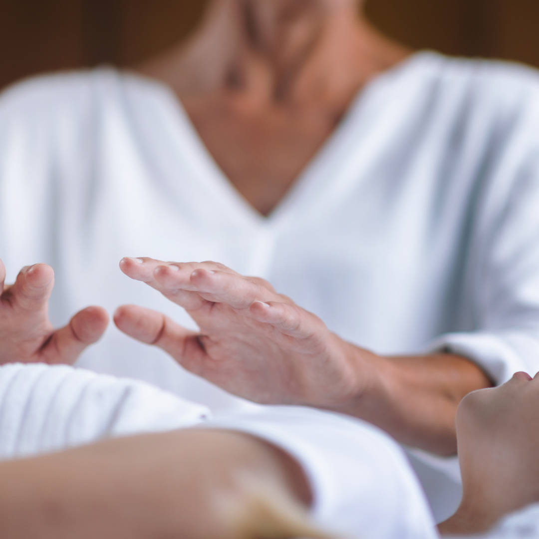 ISHA Practitioner practicing hands-on healing