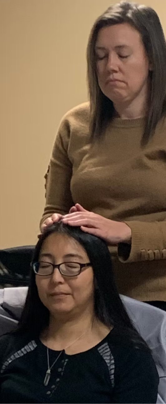 ISHA Practitioner practicing hands-on healing