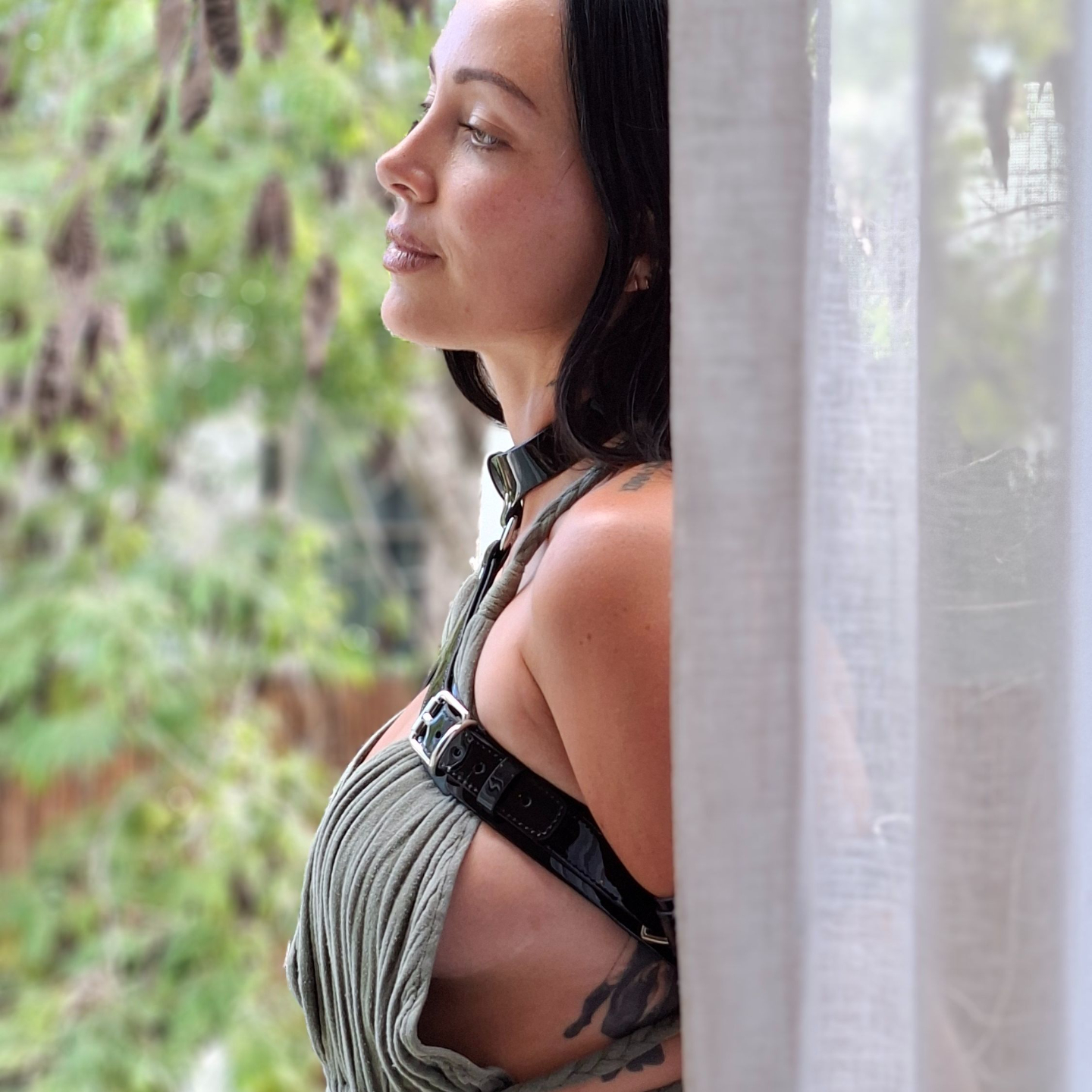 juileta in leather looking off into the distance