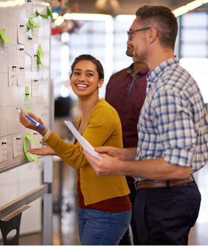 Business coach working with clients during a professional coaching session focused on strategy, decision-making, and business goals.