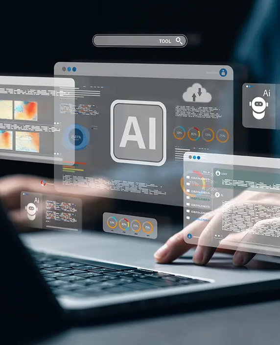 A person working on a laptop with AI interface panels and data overlays on the screen, illustrating how artificial intelligence accelerates content creation while still requiring human guidance to shape meaningful learning experiences.