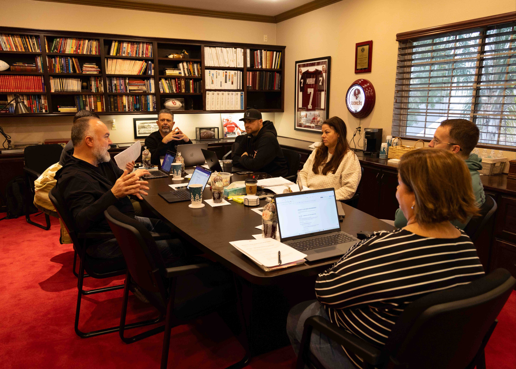 A church leadership meeting in a boardroom where the team is discussing their next steps with The Authentic Pastor consulting.