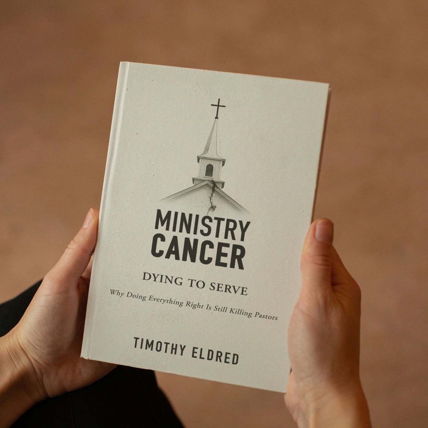 Ministry Cancer Book by Timothy Eldred being read.