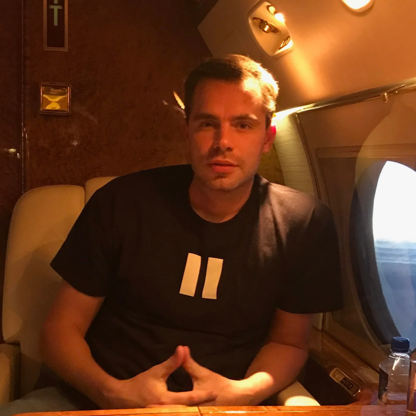 Eric Canori seated in private jet during travel