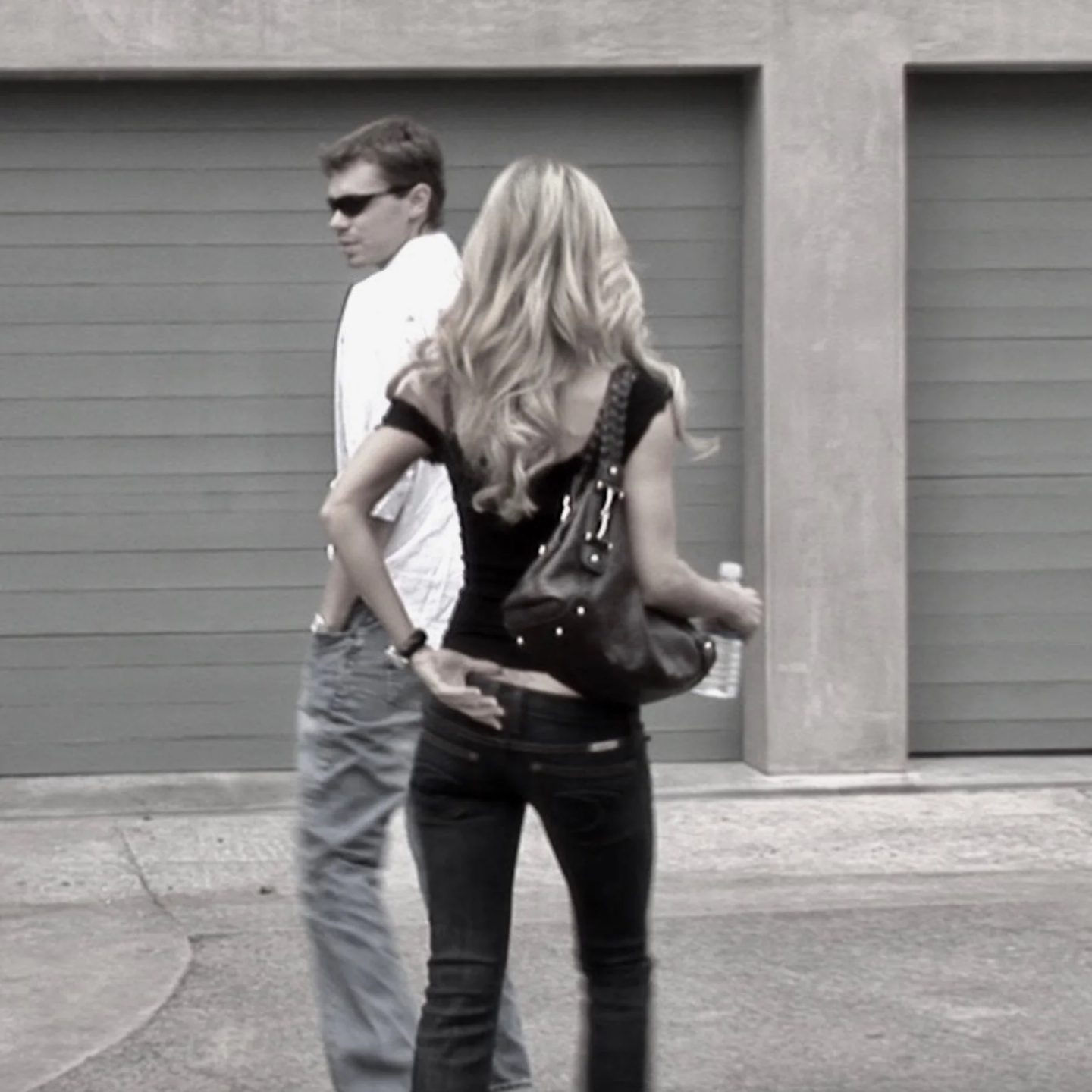 Eric Canori walking in urban setting with woman