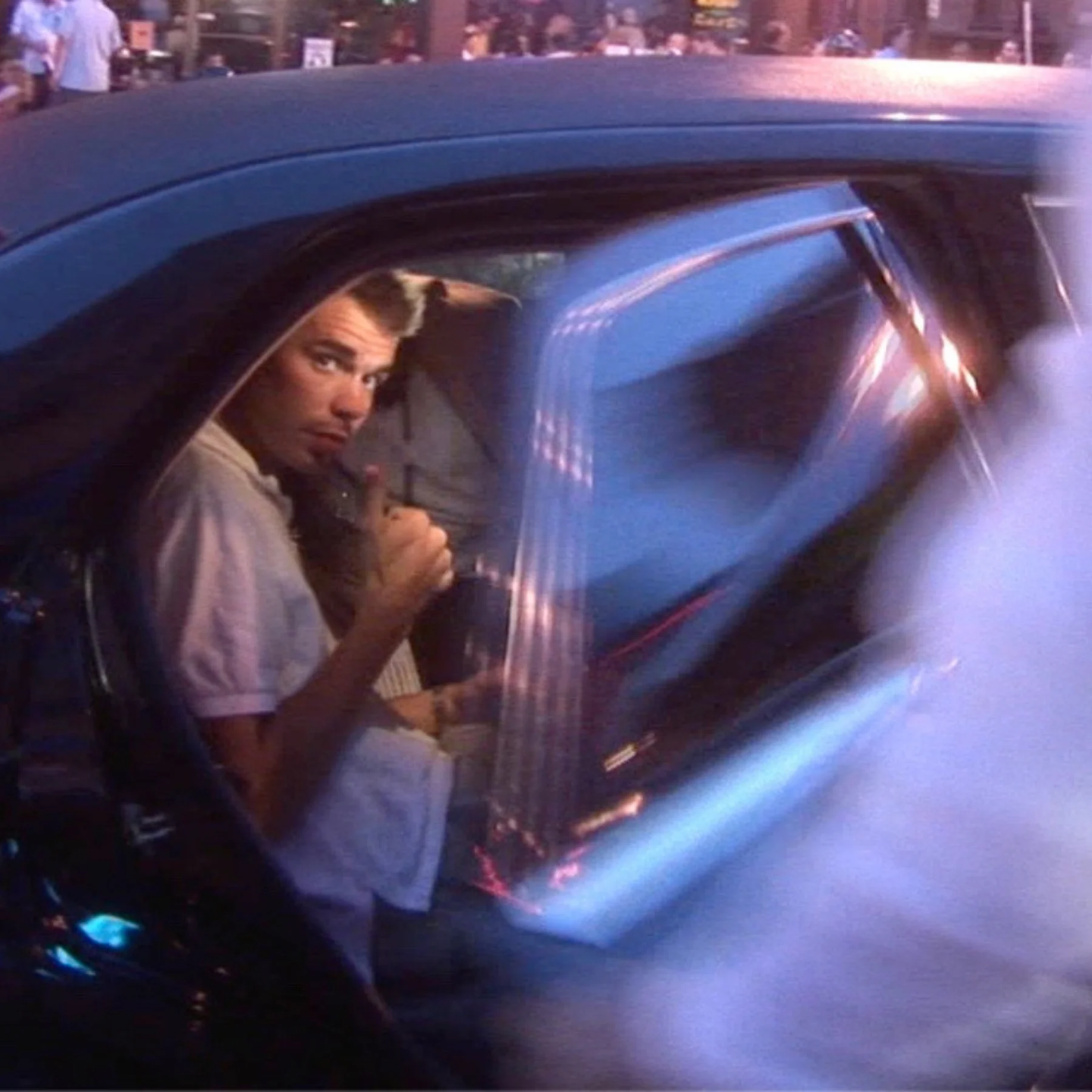 Eric Canori inside car at night in candid documentary scene