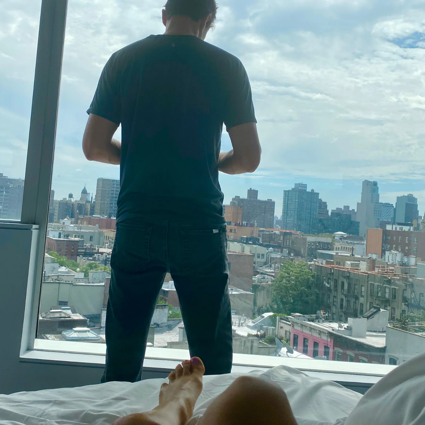 Eric Canori looks out bedroom window