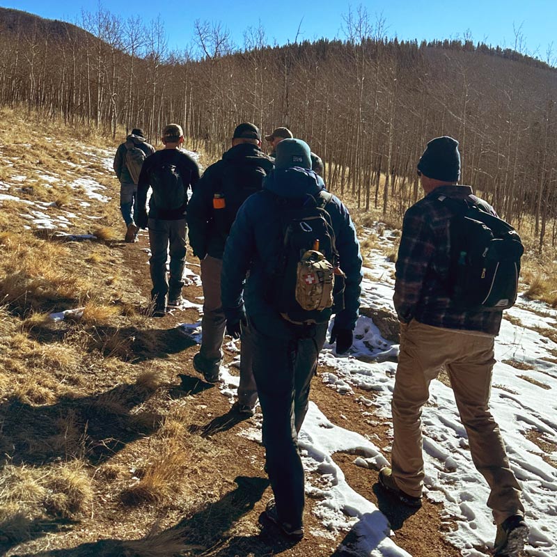 Man riding a motorcycle through the desert