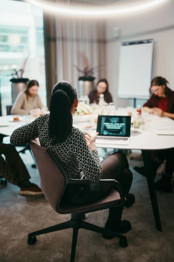 nadine sitting on a chair in an event