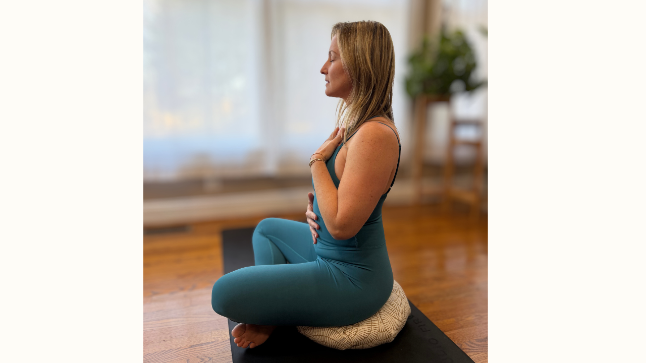 Kendall reaching in a seated stretch 