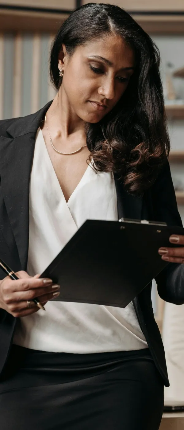 Black attorney reviewing legal documents in law firm office