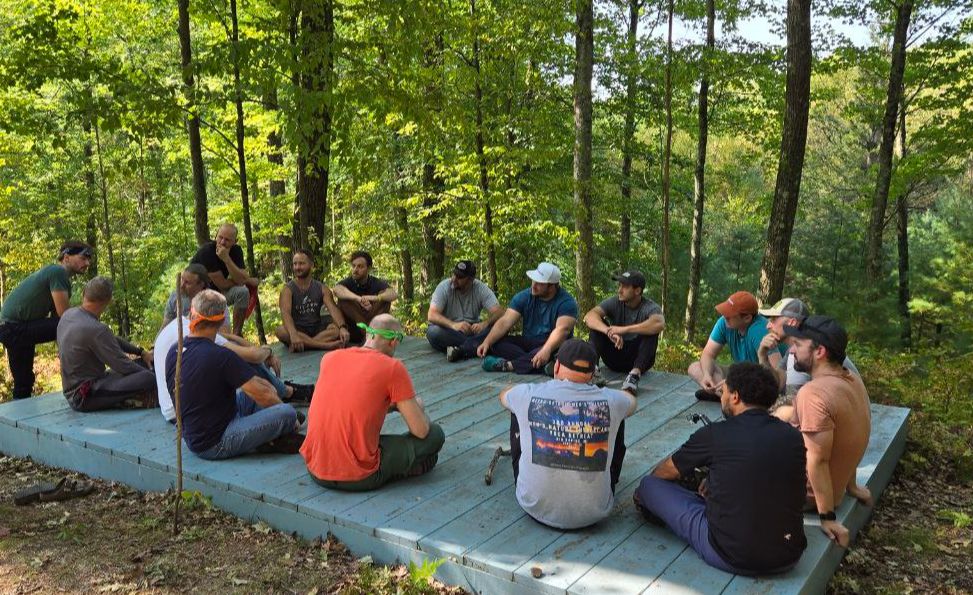 A group of men standing together, representing the brotherhood and community of men's group therapy at Metro-Detroit Men's Therapy