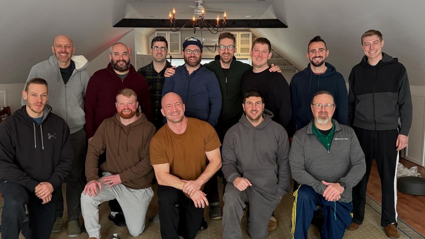 A group of men gathered together at a Metro-Detroit Men's Therapy men's group event, representing the brotherhood and community of men's group therapy