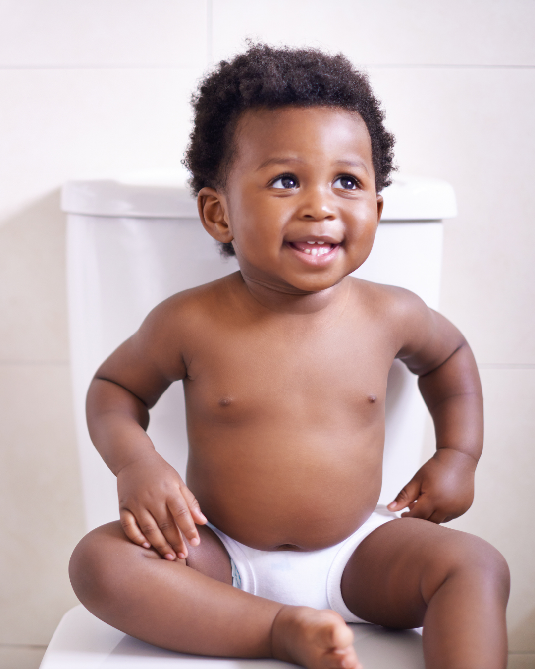 Toddler stood by a potty