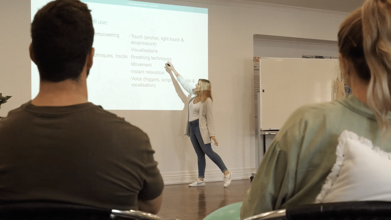 Hypnobirthing Australia™ Course Attendees looking at Class PowerPoint Presentation