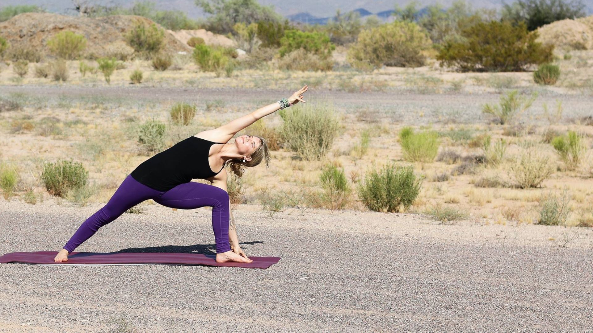 a woman doing yoga in the desert