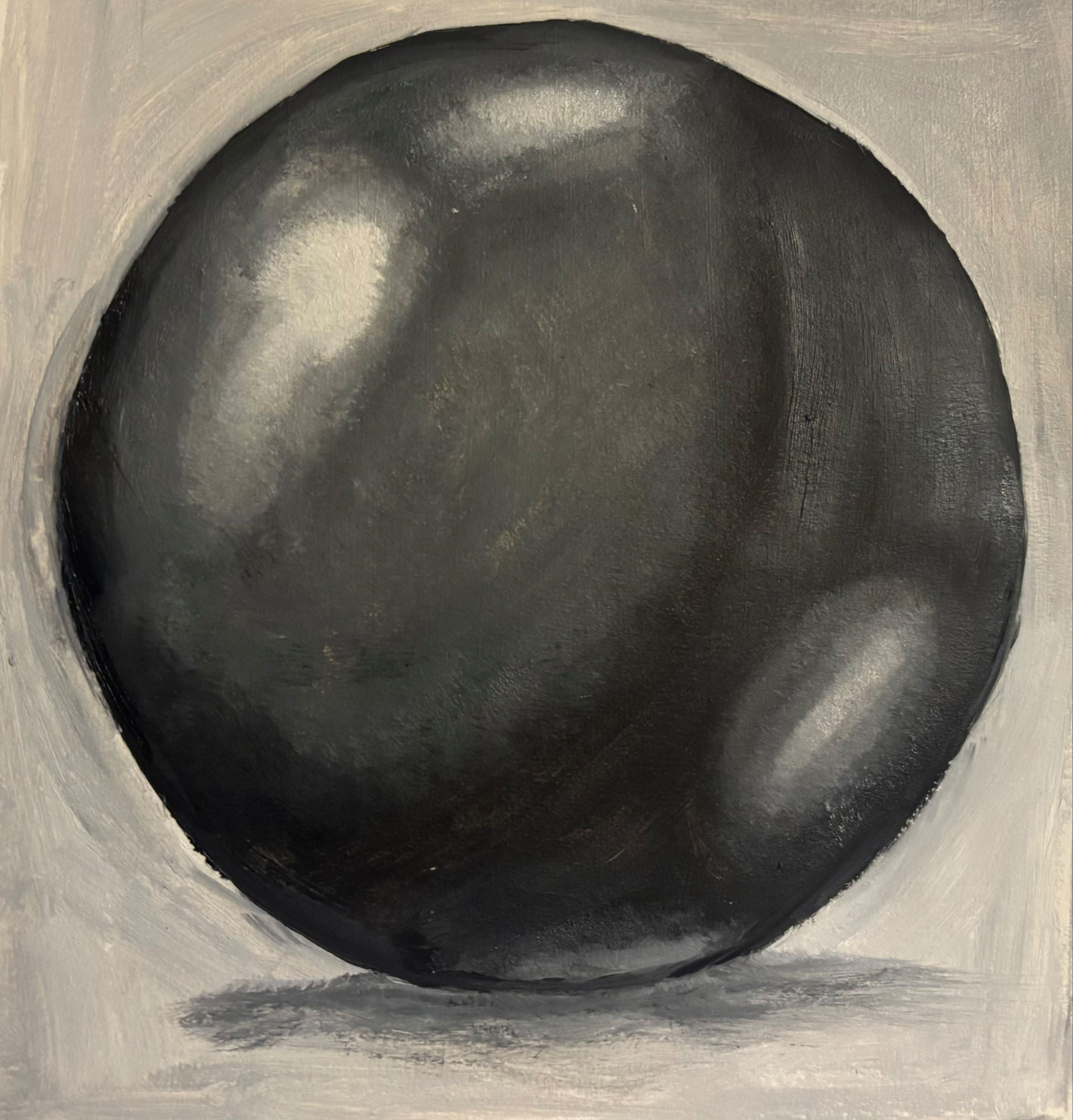 Oil painting of a black sphere created during the still life course