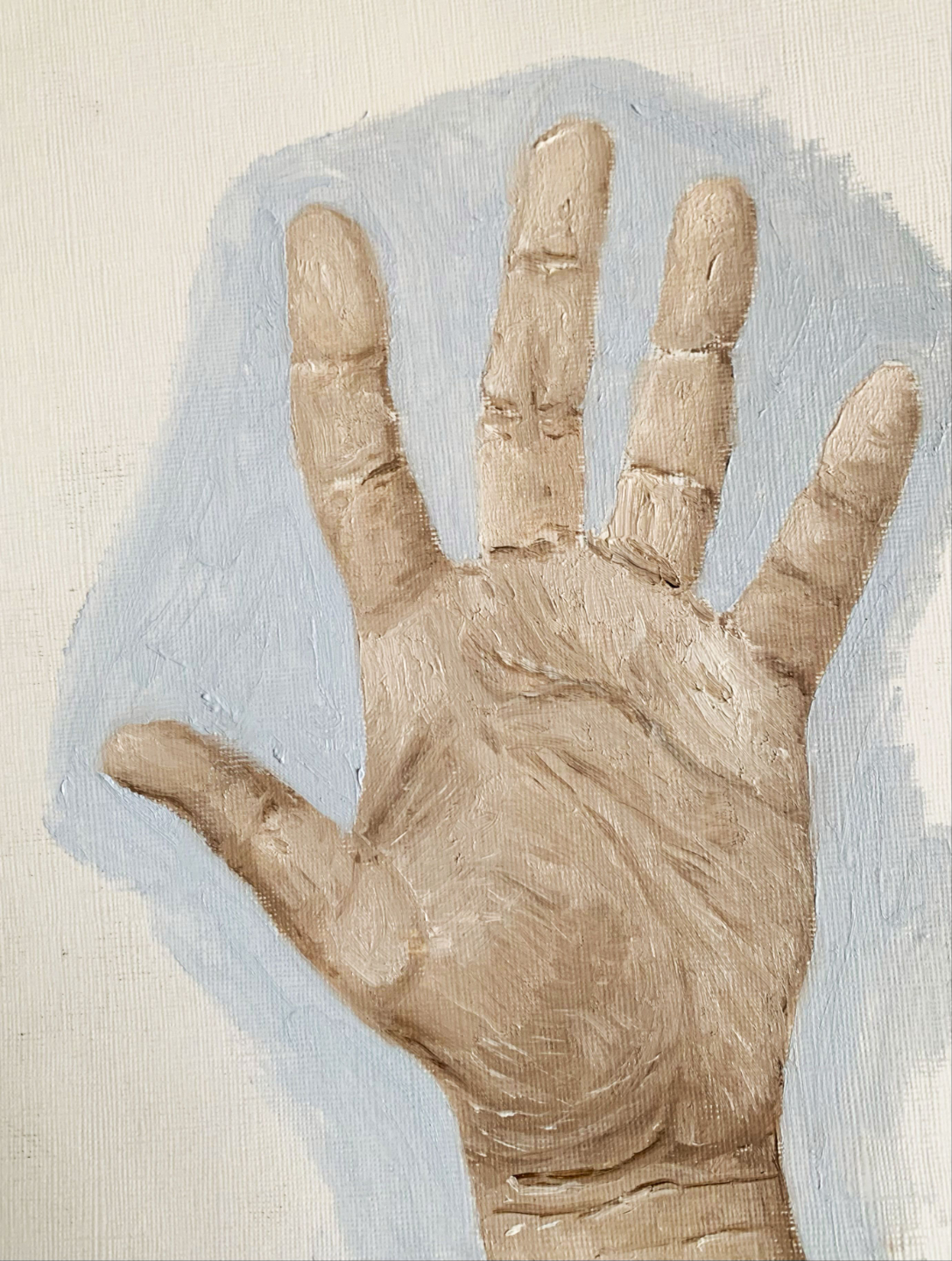 Student artwork focusing on skin tones and light transitions with the painting of a hand