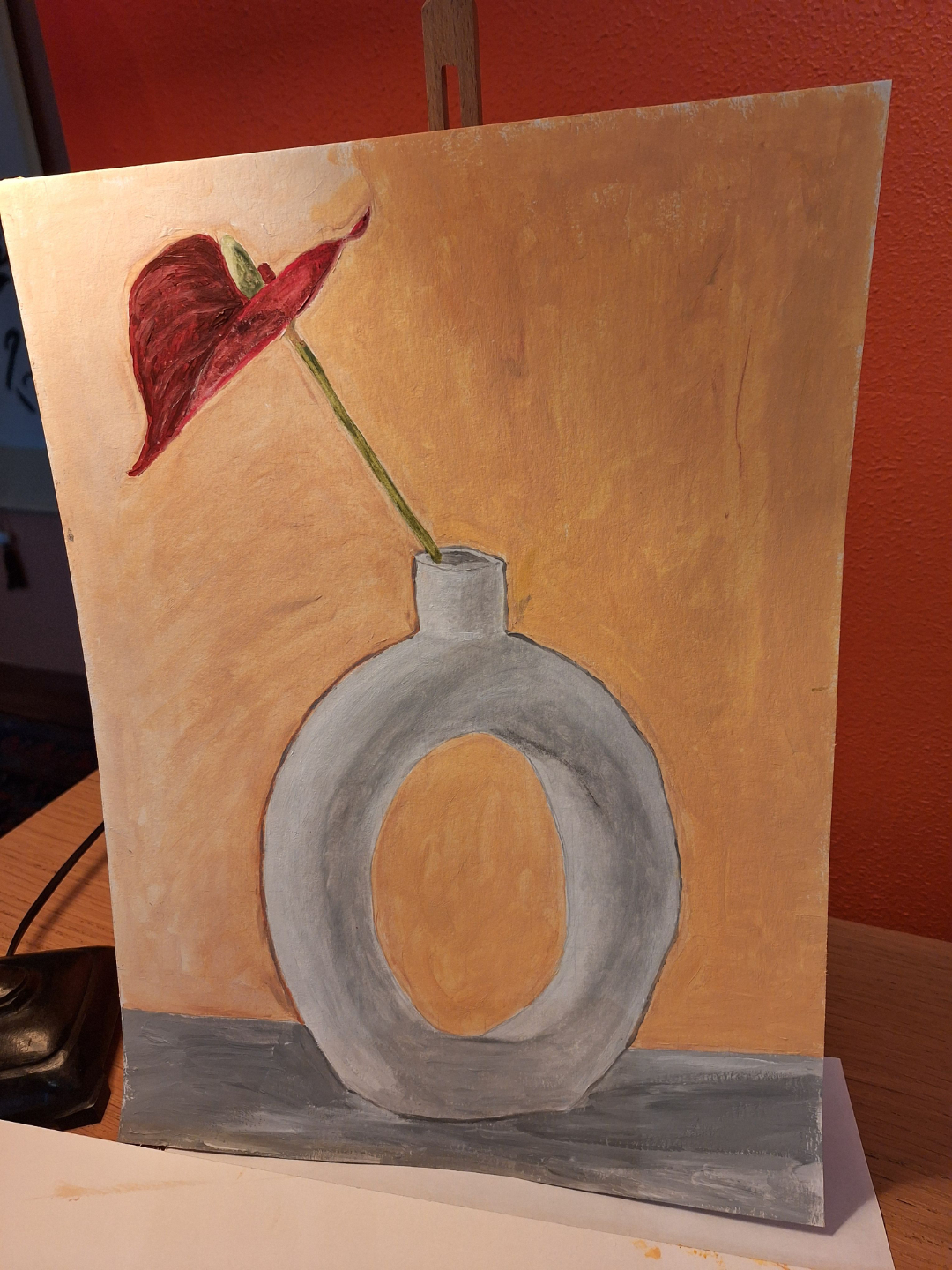 Oil painting of a red flower in a vase created during the still life course