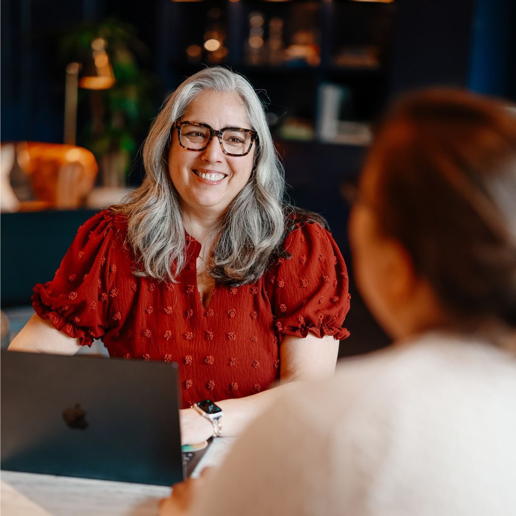 Danielle in black talking to someone