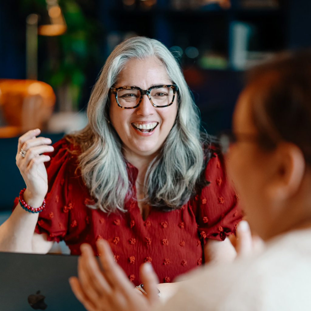 Danielle in black talking to someone