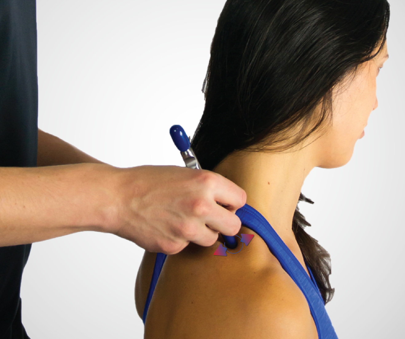 an IASTM tool using fascial manipulation on the trapezius muscle.