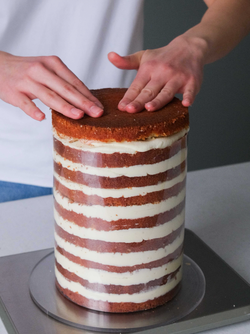 Coconut cake assembly — layered sponge with cream filling