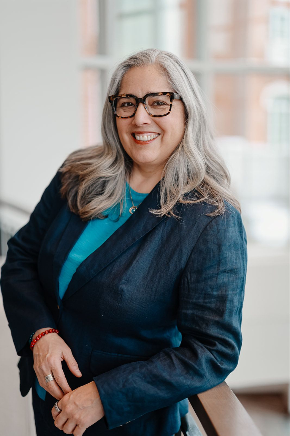 Danielle facing camera with window behind