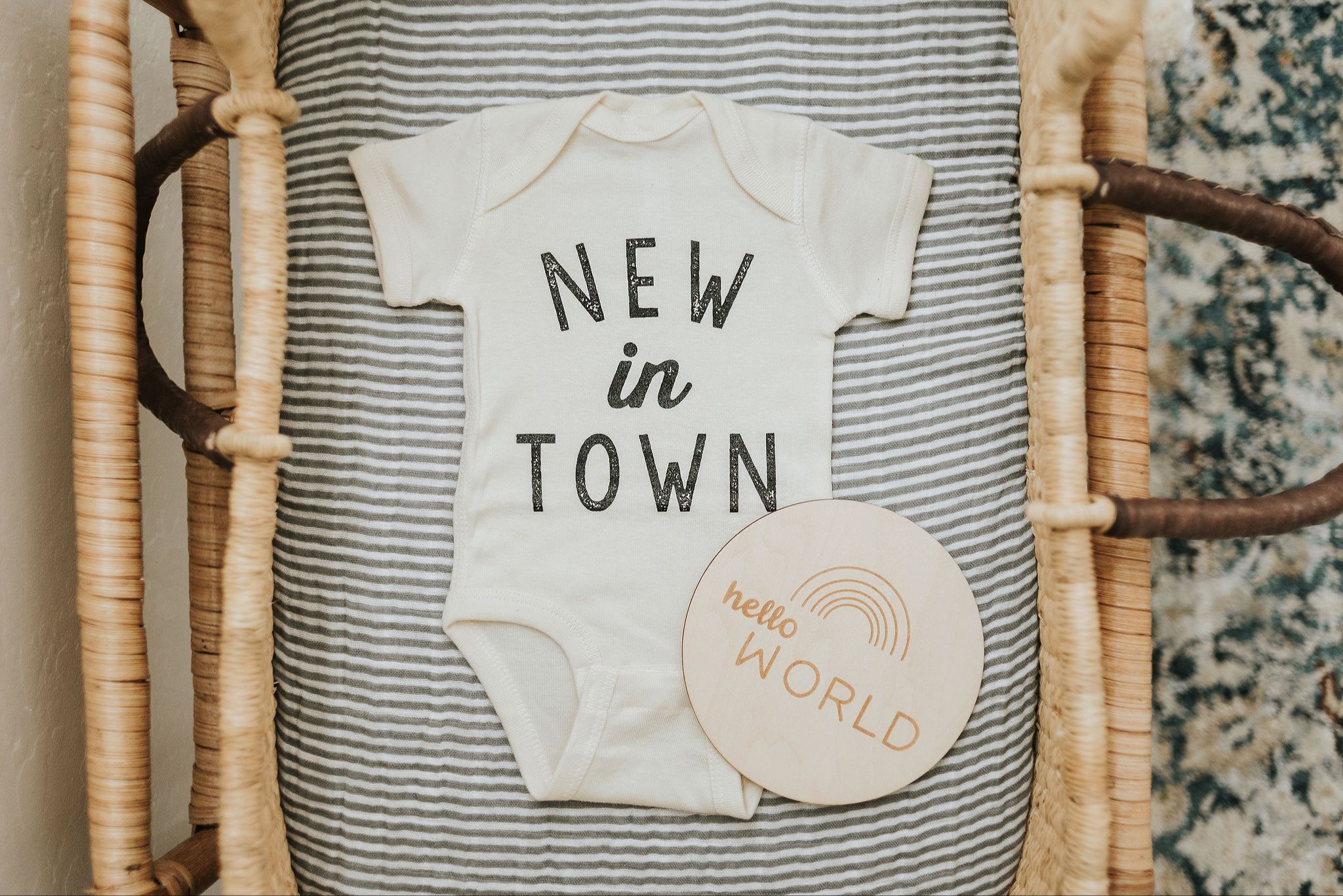 Pregnant mama preparing for baby sleep with newborn essentials