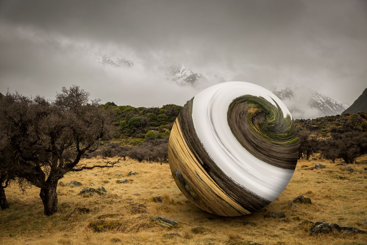 A photograph of a sky full of fireworks exploding over the city of Brisbane, reflected in the river, showing how to take fireworks photography long exposures.